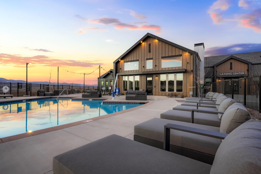 Swimming pool in front of clubhouse at Prose at Parkvale apartments for rent in Littleton, CO.